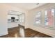 Open living room view to kitchen, with hardwood floors, windows, and archways, for great light and flow at 1337 M L King Jr Nw Dr, Atlanta, GA 30314