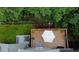 Overhead view of a beautifully designed deck with an American flag, furniture, and lush green surroundings at 2075 Pine Tree Dr, Buford, GA 30518