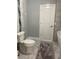 Stylish bathroom featuring marble-look tile and a modern toilet at 2075 Pine Tree Dr, Buford, GA 30518