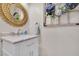 Bathroom featuring vanity with marble countertop and stylish mirror at 2075 Pine Tree Dr, Buford, GA 30518