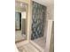 Bathroom with glass-enclosed shower and decorative tile work at 2075 Pine Tree Dr, Buford, GA 30518
