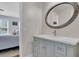 Updated bathroom with custom vanity and decorative mirror at 2075 Pine Tree Dr, Buford, GA 30518