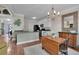 Eat-in kitchen features stainless steel appliances, granite counters, and modern light fixture at 2075 Pine Tree Dr, Buford, GA 30518