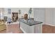 Open concept kitchen with granite countertops and breakfast bar at 2075 Pine Tree Dr, Buford, GA 30518