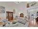 Spacious living room featuring a fireplace, built-in shelving, and an open floor plan at 2075 Pine Tree Dr, Buford, GA 30518