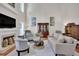 Elegant living room featuring a fireplace, built-in shelving, and stylish decor at 2075 Pine Tree Dr, Buford, GA 30518