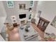 Lofted view of the living room with hardwood floors, fireplace, and built in shelving at 2075 Pine Tree Dr, Buford, GA 30518