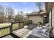 Wooden deck with a seating area, stylish furniture, potted plants, and views of the neighborhood at 330 Chaffin Ridge Ct, Roswell, GA 30075