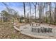 Expansive backyard with firepit area, playground, and well-manicured landscaping at 330 Chaffin Ridge Ct, Roswell, GA 30075