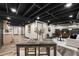 Finished basement with dining and living area and kitchenette at 330 Chaffin Ridge Ct, Roswell, GA 30075