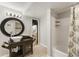 Well-lit bathroom featuring an antique vanity, a unique sink, and a shower behind a patterned curtain at 330 Chaffin Ridge Ct, Roswell, GA 30075