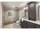 Modern bathroom with glass shower, stone tile, and spacious vanity with storage at 330 Chaffin Ridge Ct, Roswell, GA 30075