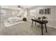 Bright bedroom featuring a bed, ceiling fan, carpet, and a desk by the window at 330 Chaffin Ridge Ct, Roswell, GA 30075