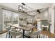 Bright dining room features large windows and a modern chandelier at 330 Chaffin Ridge Ct, Roswell, GA 30075