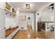 Bright and spacious entryway with hardwood floors, built-in bench, and an open view to the living areas at 330 Chaffin Ridge Ct, Roswell, GA 30075