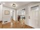 Inviting entryway with a decorative glass door, hardwood floors, and open view into the home's living spaces at 330 Chaffin Ridge Ct, Roswell, GA 30075