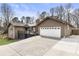 Charming two-story home with a well-maintained lawn and an attached two-car garage at 330 Chaffin Ridge Ct, Roswell, GA 30075