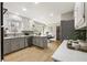 Well-lit kitchen with stainless steel appliances and gray and white cabinets at 330 Chaffin Ridge Ct, Roswell, GA 30075
