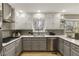 Well-designed kitchen features stainless steel appliances and subway tile backsplash at 330 Chaffin Ridge Ct, Roswell, GA 30075