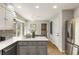 The kitchen island offers counter seating and extra room for food prep at 330 Chaffin Ridge Ct, Roswell, GA 30075
