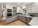 The kitchen has updated appliances, stylish backsplash, and plenty of storage at 330 Chaffin Ridge Ct, Roswell, GA 30075