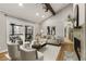Living room with vaulted ceilings, view to covered porch, fireplace and hardwood floors at 330 Chaffin Ridge Ct, Roswell, GA 30075