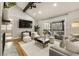 Open-concept living room with fireplace and sliding glass doors to covered porch at 330 Chaffin Ridge Ct, Roswell, GA 30075
