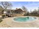 Backyard showcasing a large swimming pool and a charming home with a spacious deck at 330 Chaffin Ridge Ct, Roswell, GA 30075