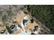 This aerial view shows the layout of the house, driveway, and the in-ground pool in the backyard at 75 Horseshoe Dr, Covington, GA 30014
