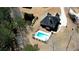 Aerial view of a beautiful home with a well-manicured lawn and inviting in-ground pool at 75 Horseshoe Dr, Covington, GA 30014