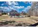 The large fenced-in backyard features an in-ground pool, a grassy lawn, and a small deck off the house at 75 Horseshoe Dr, Covington, GA 30014