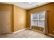 Bedroom with neutral walls, plush carpet and a large window with natural light at 75 Horseshoe Dr, Covington, GA 30014