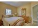 Cozy bedroom features natural light, a comfortable bed, and a wooden dresser and mirror at 75 Horseshoe Dr, Covington, GA 30014