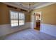 Dining room with decorative trim and chandelier and an adjacent kitchen at 75 Horseshoe Dr, Covington, GA 30014