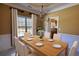 Dining room furnished with chandelier, table set, chairs, and kitchen view at 75 Horseshoe Dr, Covington, GA 30014