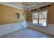Dining room featuring decorative ceiling, chandelier and large window at 75 Horseshoe Dr, Covington, GA 30014
