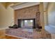 Detailed brick fireplace with a hearth, perfect for cozy evenings in the living room at 75 Horseshoe Dr, Covington, GA 30014