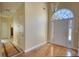 Inviting foyer with hardwood floors, high ceilings, and an elegant arched doorway with side lights at 75 Horseshoe Dr, Covington, GA 30014