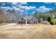 Charming single-Gathering home with brick facade, well-manicured lawn and a long driveway at 75 Horseshoe Dr, Covington, GA 30014