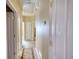 Hallway with multiple doorways, carpet flooring, and neutral paint, offering access to various rooms at 75 Horseshoe Dr, Covington, GA 30014