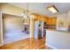Open kitchen area featuring stainless steel appliances, wood cabinets, and a breakfast bar leading to the living room at 75 Horseshoe Dr, Covington, GA 30014