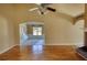 Bright living room featuring hardwood floors and archway to carpeted room at 75 Horseshoe Dr, Covington, GA 30014