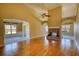Spacious living room with hardwood floors, vaulted ceilings, and a brick fireplace, great for entertaining at 75 Horseshoe Dr, Covington, GA 30014