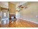 Spacious living room featuring hardwood floors and brick fireplace at 75 Horseshoe Dr, Covington, GA 30014