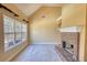 Living room with a fireplace and large window at 75 Horseshoe Dr, Covington, GA 30014