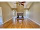 Hardwood floors highlight this spacious living room, featuring a brick fireplace, archways and tall ceilings at 75 Horseshoe Dr, Covington, GA 30014