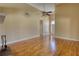 Open-concept living room with hardwood floors and ample natural light at 75 Horseshoe Dr, Covington, GA 30014