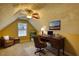 Bright home office features a wooden desk, comfy chair, and a window with natural light at 75 Horseshoe Dr, Covington, GA 30014