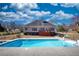 Fenced in in-ground pool features a concrete patio area and stairs leading to a small deck on the home at 75 Horseshoe Dr, Covington, GA 30014