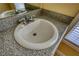 Close-up of a bathroom sink with a granite countertop and chrome faucet at 75 Horseshoe Dr, Covington, GA 30014